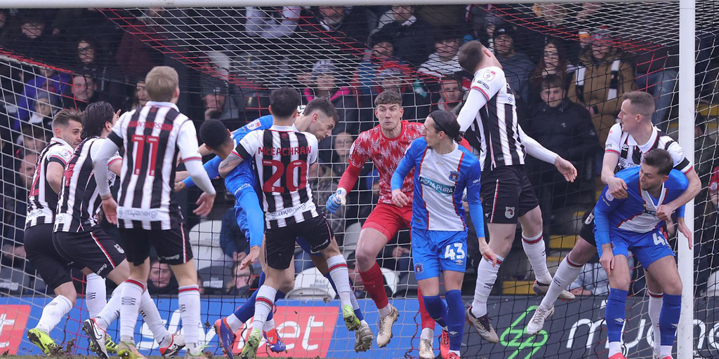 Mark Hughes Faces Tough Start: Carlisle Falls to Grimsby